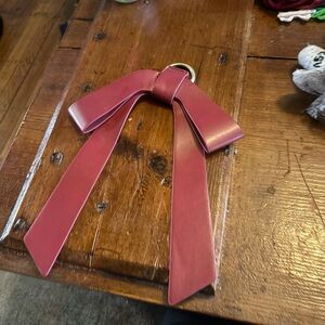 Red Leather Bow with furnished loop hook for use on handbags, belts, etc.